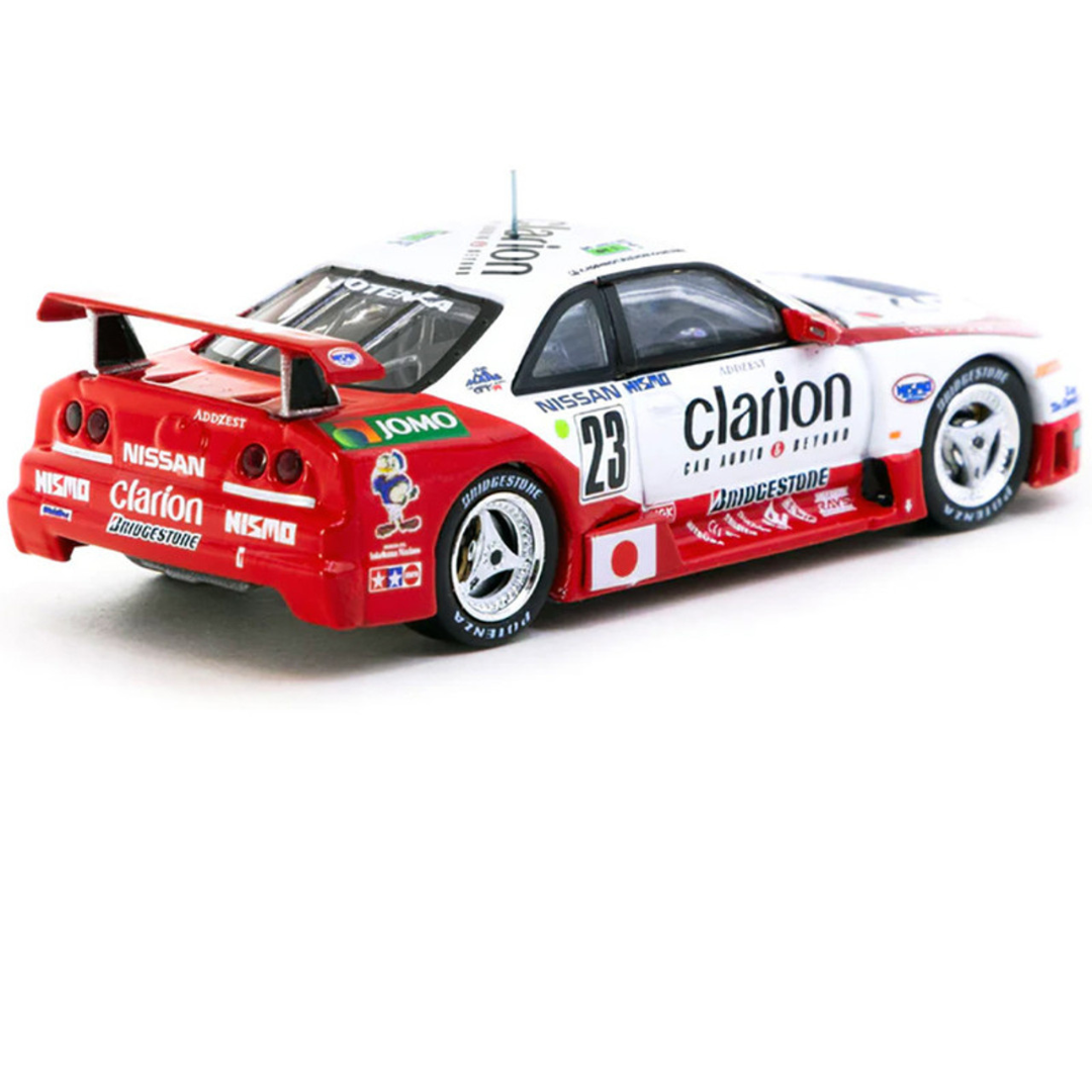 Tarmac Works 1.64 Nissan NISMO GT-R LM de Tarmac Works, 24 Horas de Le Mans 1995. Presentación de K. Hoshino, T. Suzuki y M. Kageyama.