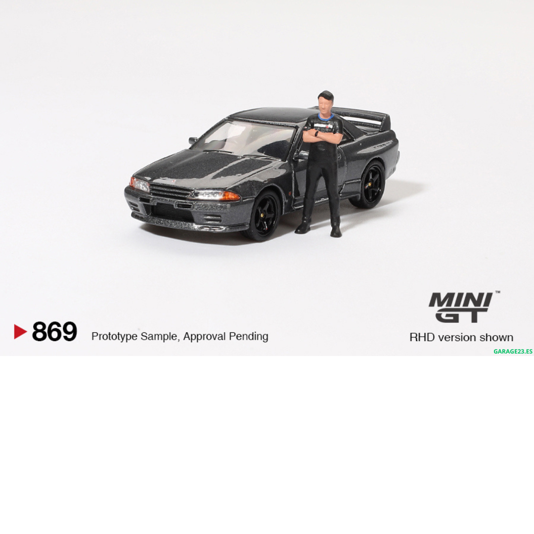 ***EN CAMINO*** MINI GT 1:64 NISSAN SKYLINE GTR R32 NISMO NISMO GUNMETAL CON FIGURA TSUGIO MATSUDA #869