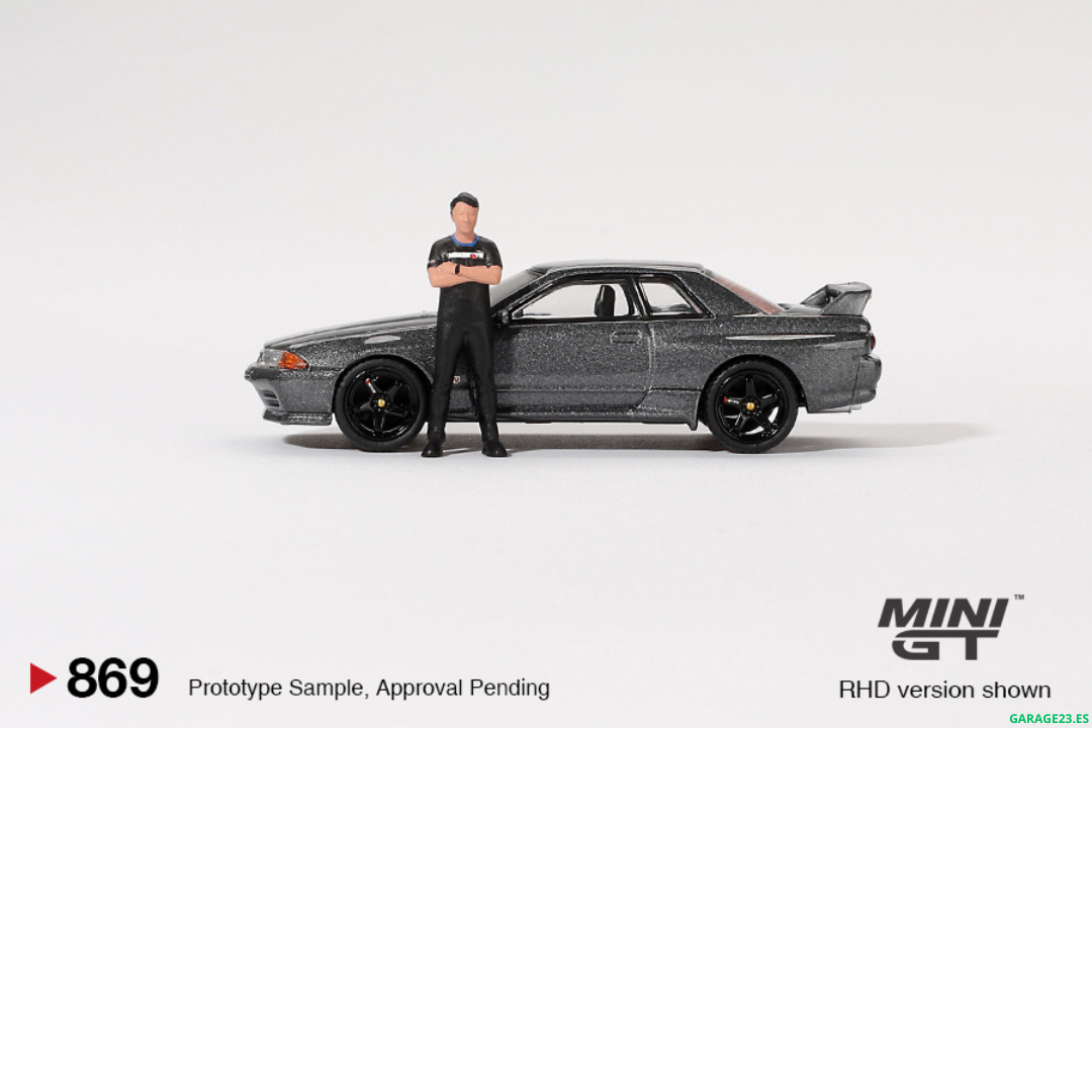 ***EN CAMINO*** MINI GT 1:64 NISSAN SKYLINE GTR R32 NISMO NISMO GUNMETAL CON FIGURA TSUGIO MATSUDA #869